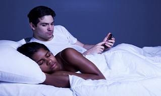 signs of infidelity -hiding cellphone